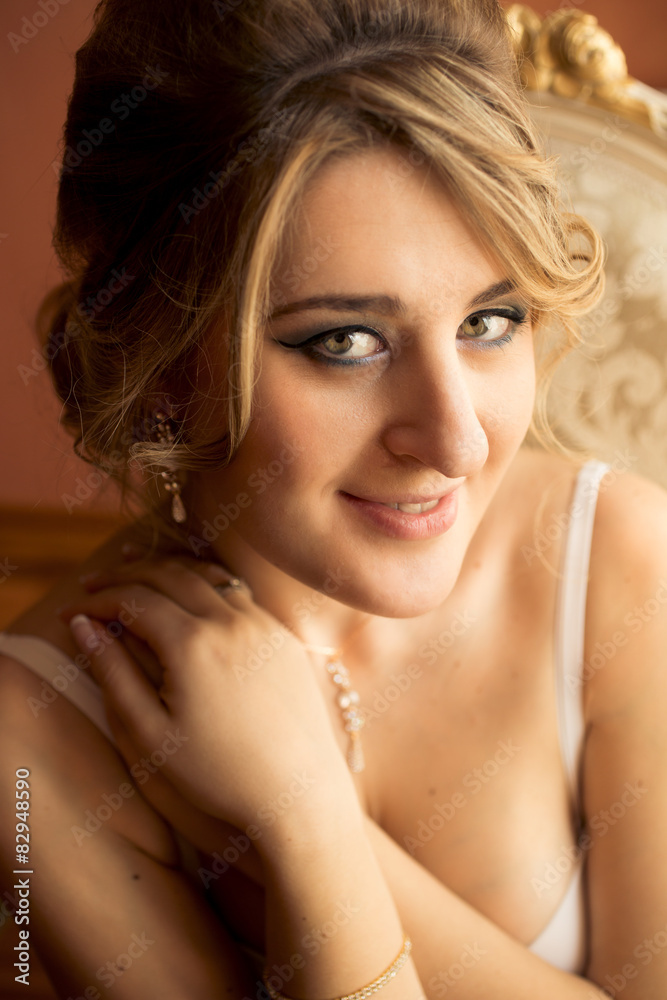 cute blonde woman with green eyes posing at luxurious bedroom cute blonde woman with green eyes posing at luxurious bedroom