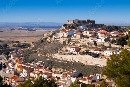  Chinchilla de Monte-Aragon with medieval castle at hill © JackF