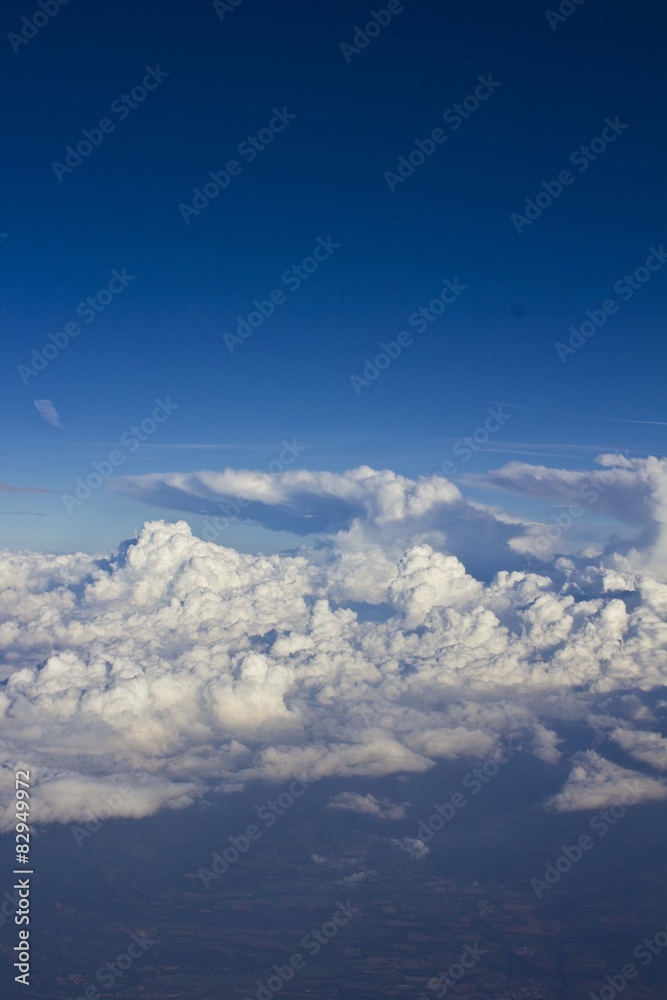 Fototapeta premium Clouds background as seen by the airplane