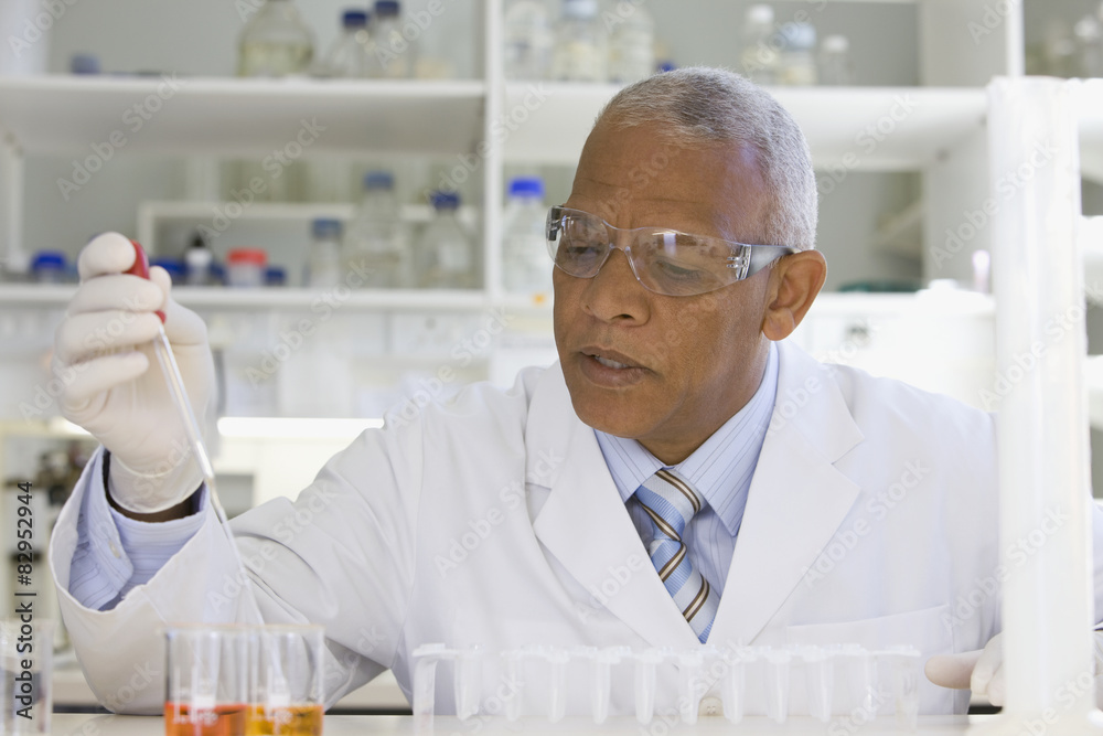 African scientist performing analysis in laboratory African scientist performing analysis in laboratory