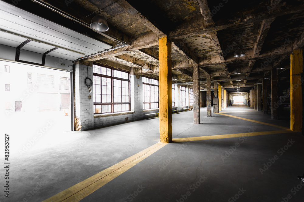 old abandoned factory hallway with big windows old abandoned factory hallway with big windows