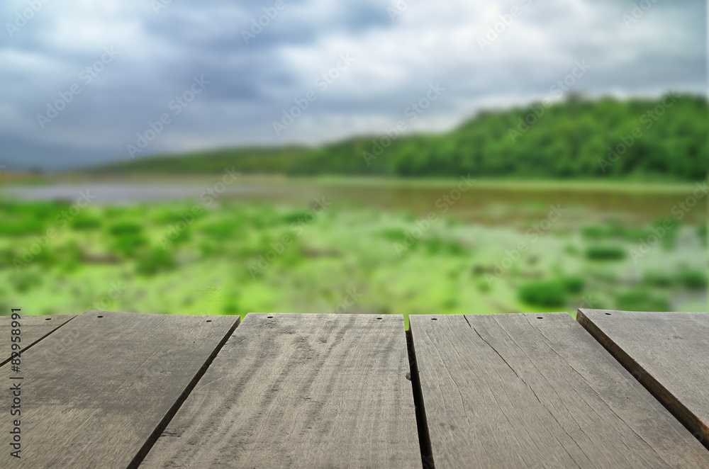 Defocused and blur image of terrace wood and lake scenery view Defocused and blur image of terrace wood and lake scenery view