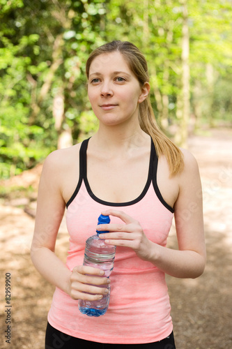 a runner holding a bottle of water
