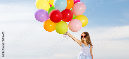 happy girl with colorful balloons