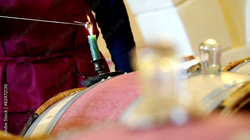 Close up on burning sulfur on a candle in a wine cellar. Close up on burning sulfur on a candle in a wine cellar.
