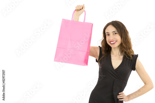 Woman showing paper shopping bag