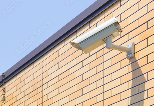 Video camera security system on the wall of the building.