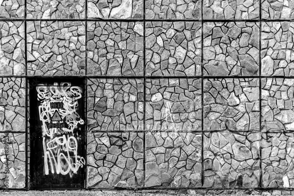 Fototapeta premium Vandalized Door and Stone Wall