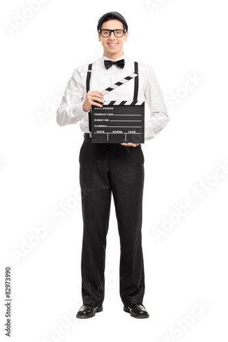 Young movie director holding a movie clapperboard © Ljupco Smokovski