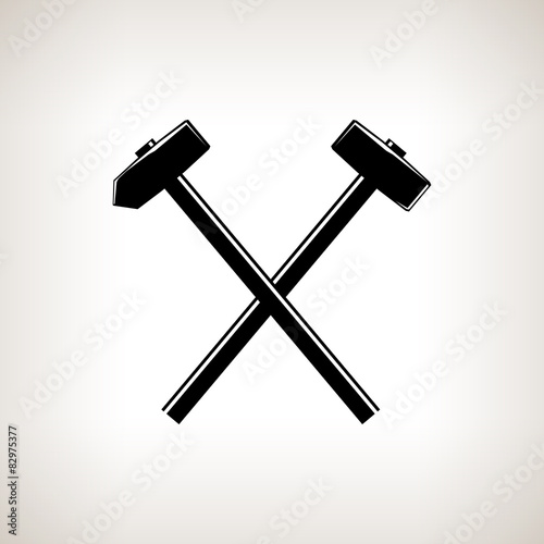 Silhouette of a crossed hammer and sledgehammer