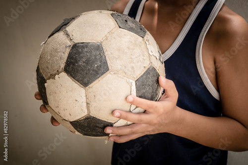 Children hold the old football  © Nattapol_Sritongcom