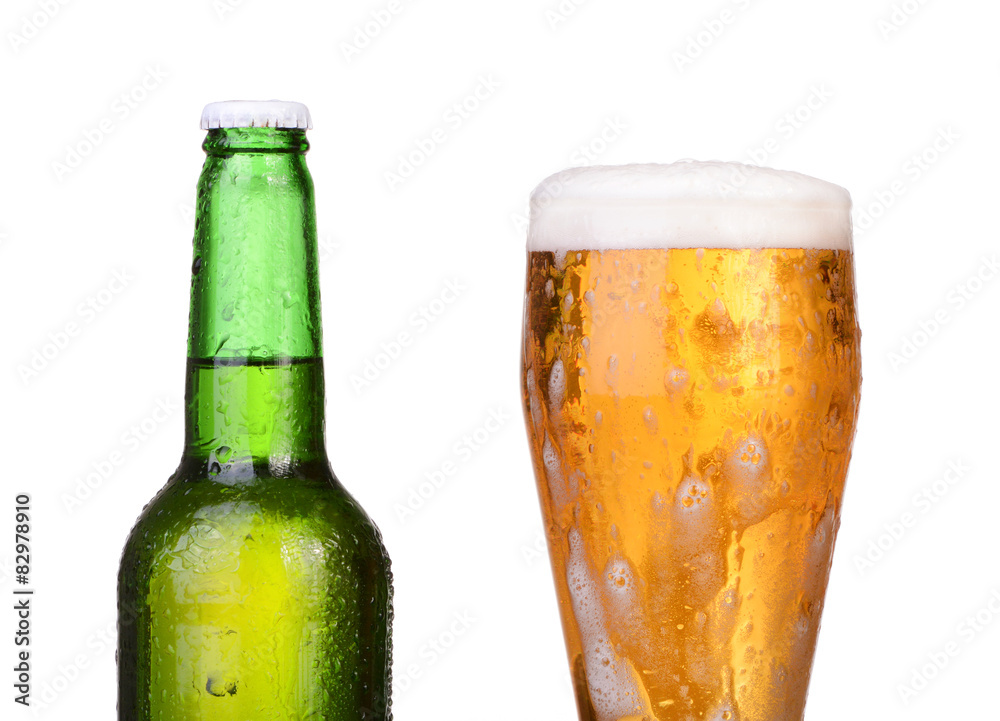 Chilled green bottle with condensate and a glass of beer lager Chilled green bottle with condensate and a glass of beer lager
