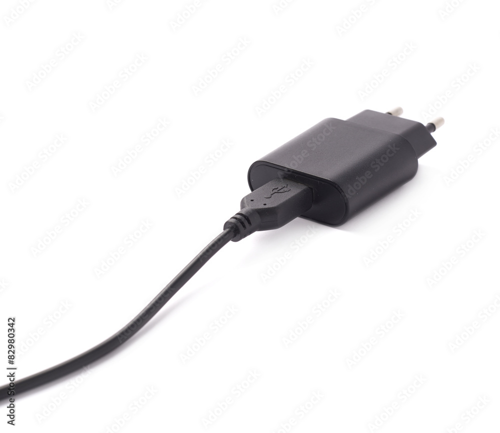 Fragment of the black adapter charger isolated Fragment of the black adapter charger isolated