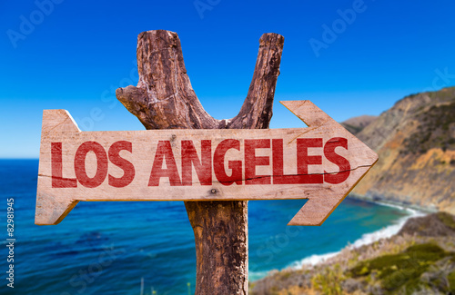Los Angeles wooden sign with coast background