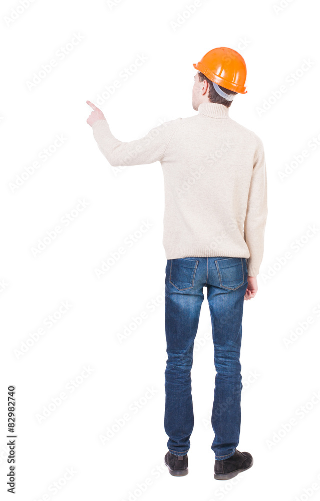 Back view of pointing young men in helmet. Back view of pointing young men in helmet.