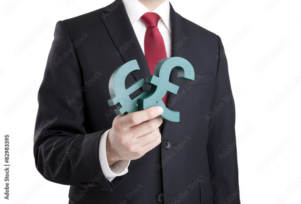 Businessman holding euro and pound signs with clipping path Businessman holding euro and pound signs with clipping path