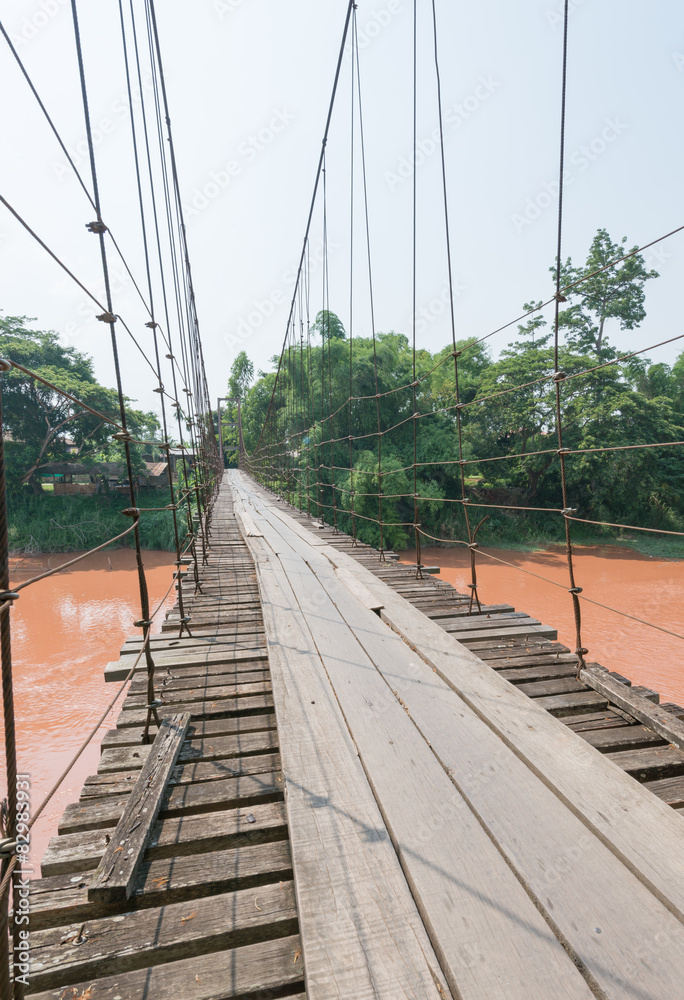 Hanging bridge across river.