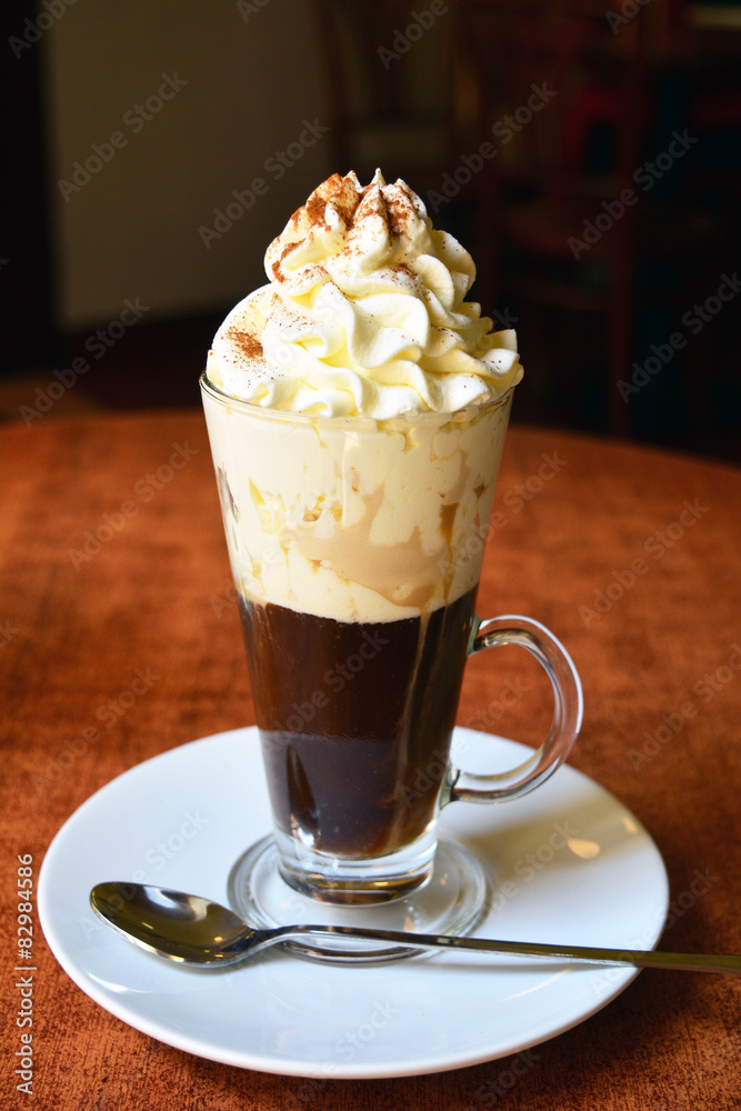 Viennese coffee in glass cup with whipped cream Viennese coffee in glass cup with whipped cream