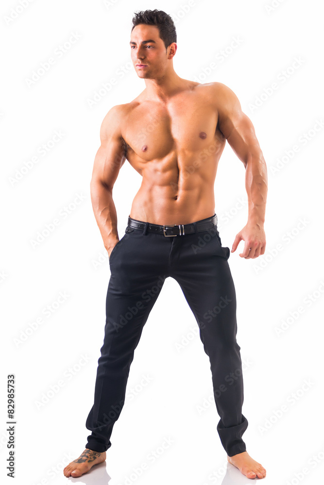 Shirtless musculeman with elegant pants, standing, isolated Shirtless musculeman with elegant pants, standing, isolated