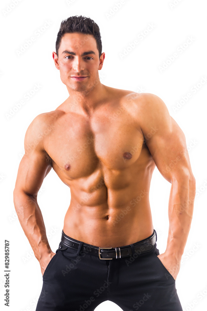 Shirtless musculeman with elegant pants, standing, isolated Shirtless musculeman with elegant pants, standing, isolated