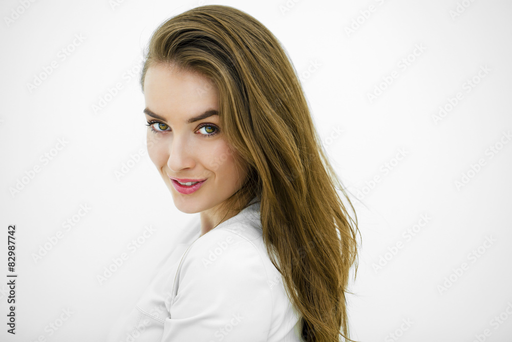 Beautiful young happy woman posing against a white wall Beautiful young happy woman posing against a white wall