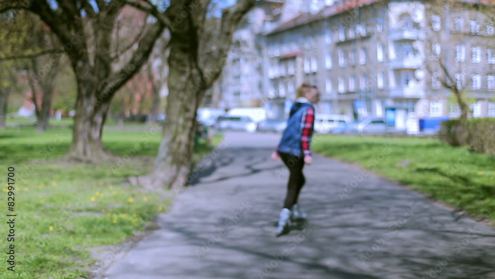 Girl smiling to the camera and having fun on rollerblades
Girl smiling to the camera and having fun on rollerblades