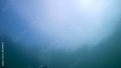 Diver with the metal detector searching   photo