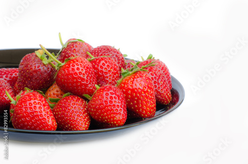 Strawberry in disk on white background