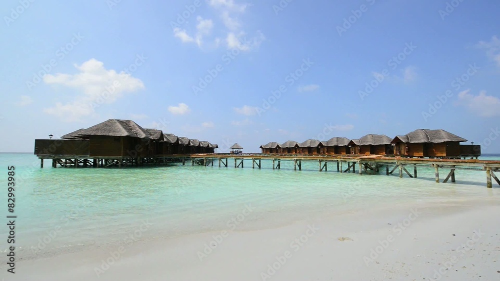 Over water bungalows with steps into amazing green lagoon