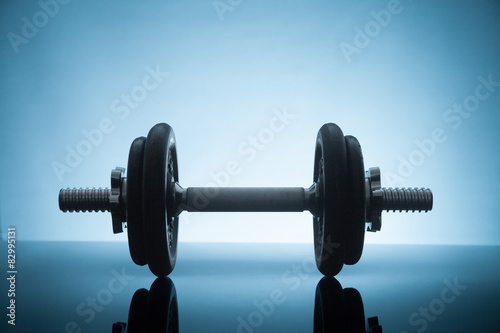 dumbbell on a shiny surface