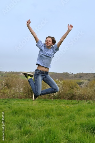 Girl jumping in a garden