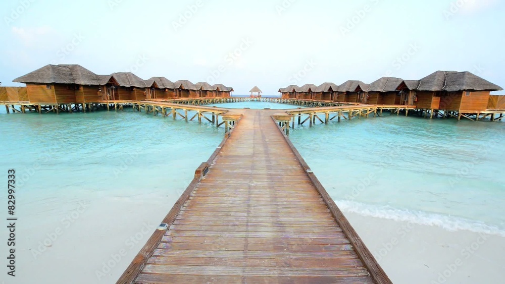 Over water bungalows with steps into amazing green lagoon Over water bungalows with steps into amazing green lagoon