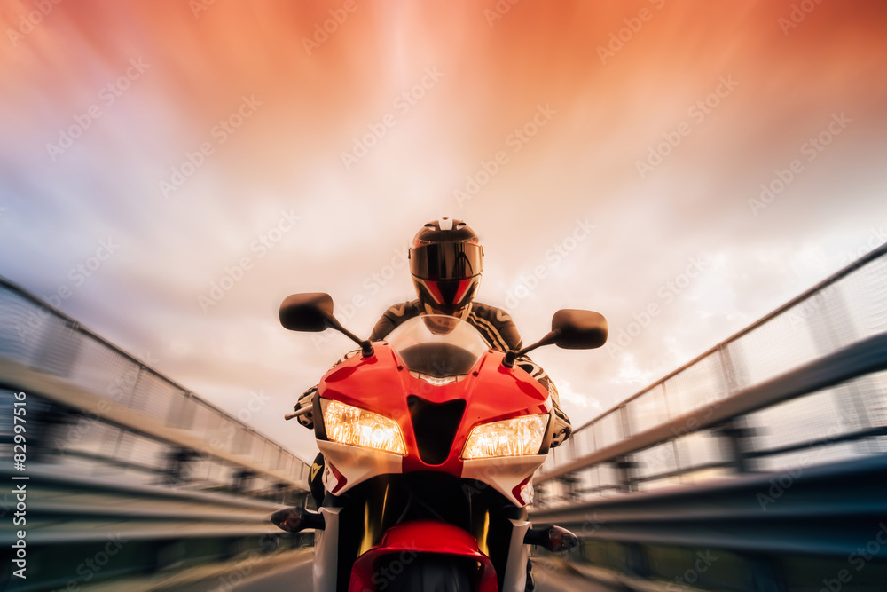 Close up of a man riding a street motorcycle