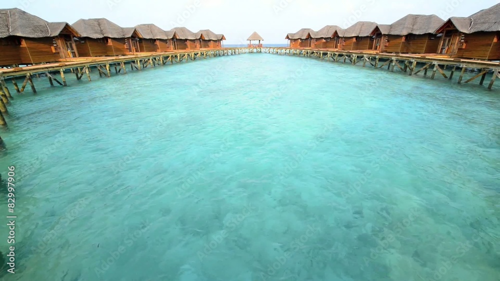 Over water bungalows with steps into amazing green lagoon Over water bungalows with steps into amazing green lagoon