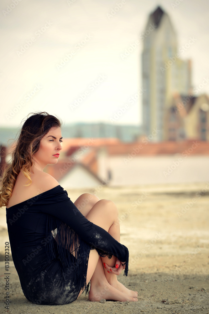 fashion woman posing on roof