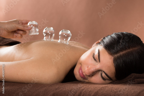 Woman Getting Cupping Treatment At Spa photo
