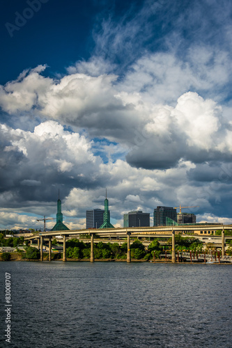 View of dramatic clouds over the Williamette River, in Portland, photo