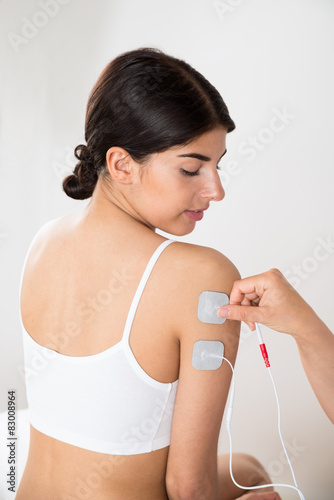 Woman Getting Electrodes Therapy On Hand