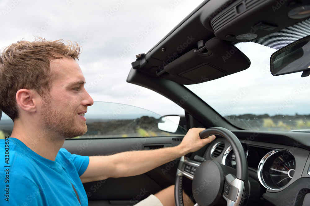 Car driver - young man driving convertible Car driver - young man driving convertible