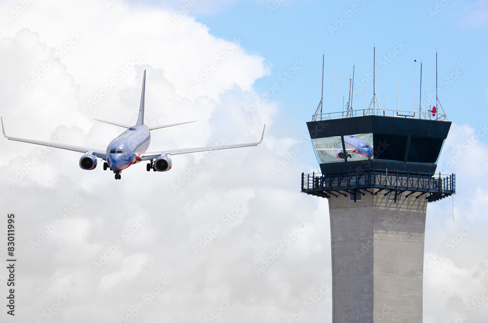 Air traffic control tower with jet airplane Stock Photo | Adobe Stock
