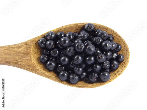 Jambolan plum or Java plum on wooden spoon
