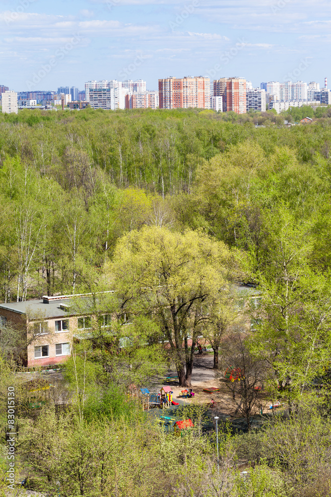 kindergarten in green woods and city in spring kindergarten in green woods and city in spring