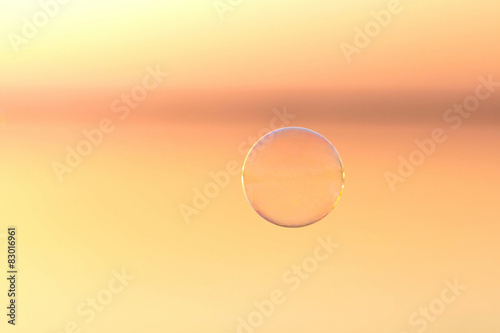 bubble flies over the water at sunset © fantom_rd