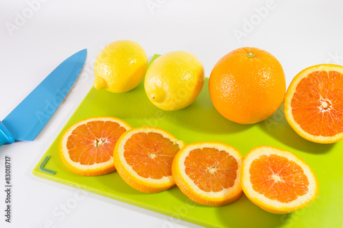 Knife And Slices Of Oranges And Lemon