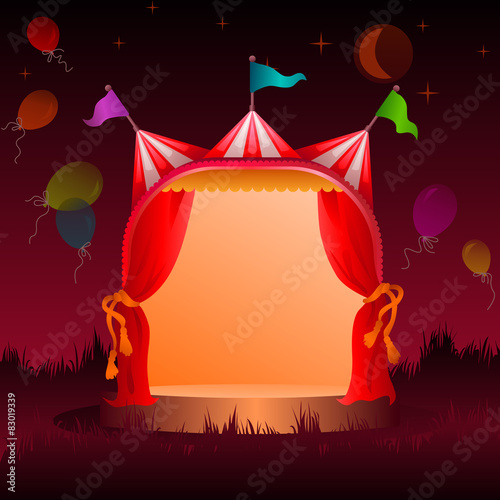 circus tent with balloons at night