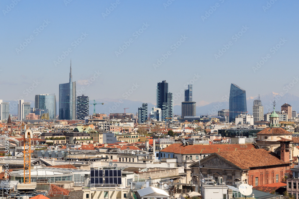 View of Milan skyline with mountains in the background