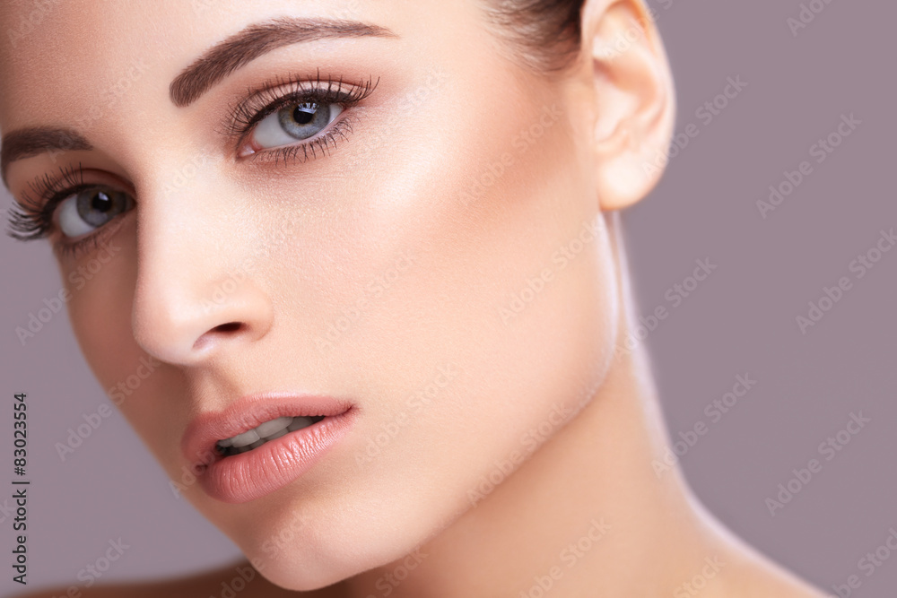Beautiful young woman with clean skin of the face. Skin Care