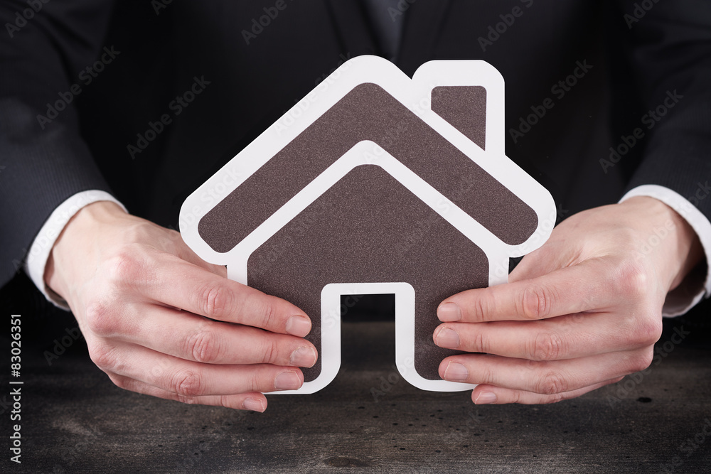 Man holding home page icon in hands