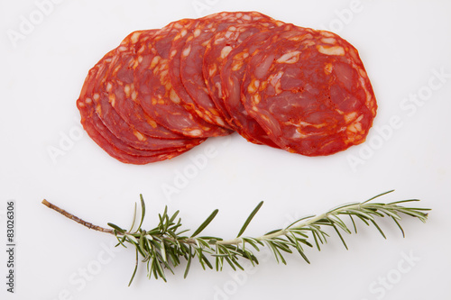 Cut slices of red iberian chorizo photo