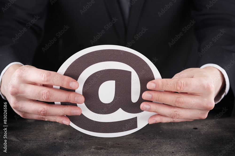 Man holding email icon in hands